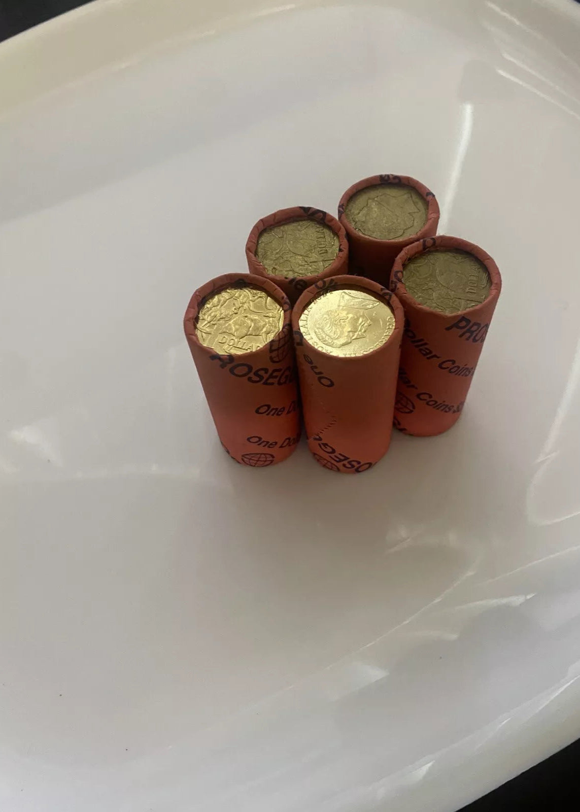 5 coin rolls of $1 denomination